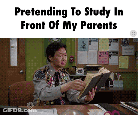 Man Pretending To Read Book In Front Of Parents GIF