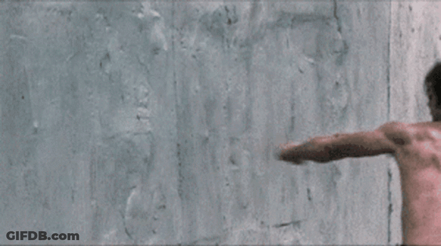 Man Punch The Wall With Power GIF