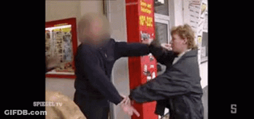 Man Punched In Face By Woman In Front Of Vending Machine GIF