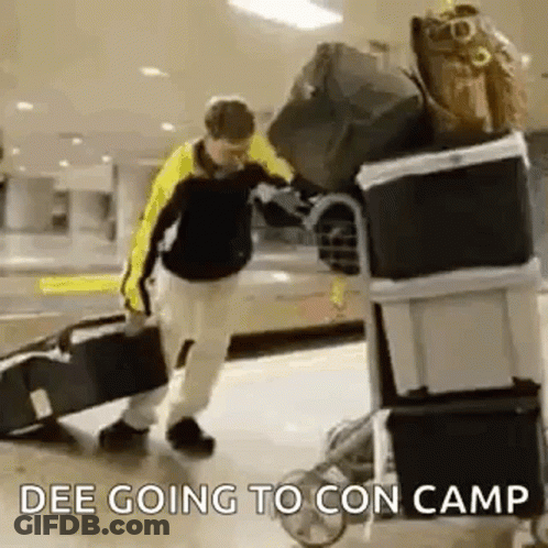 Man Pushing Cart Full Of Luggage GIF