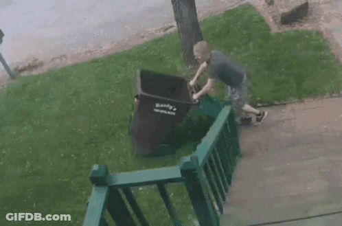 Man Pushing Garbage Can Saying Bank GIF