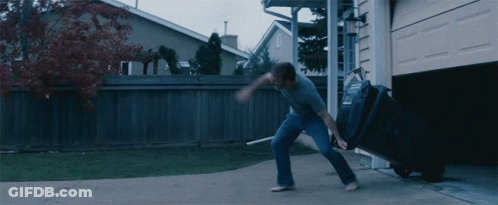Man Pushing Garbage Can With Letter L GIF