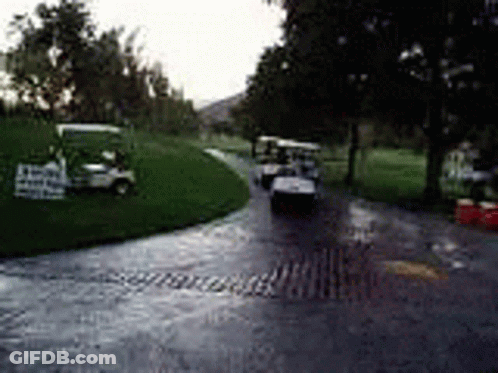 Man Pushing Golf Cart Through Mud GIF