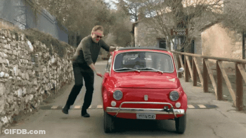 Man Pushing Red Car With Plate 2515 Jm - Gm GIF