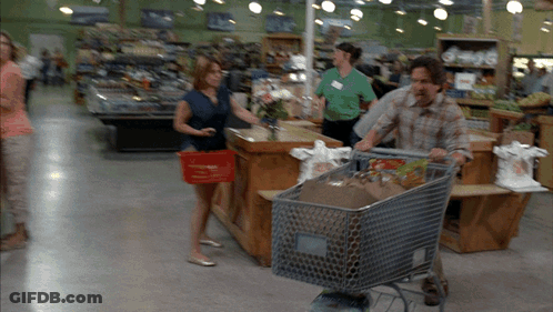 Man Pushing Shopping Cart Full Of Groceries GIF