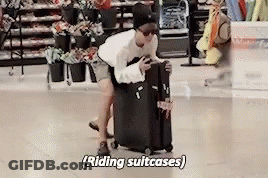 Man Pushing Suitcase Saying Riding Suitcases GIF