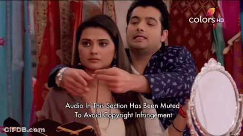 Man Putting Necklace On Woman Audio Muted GIF