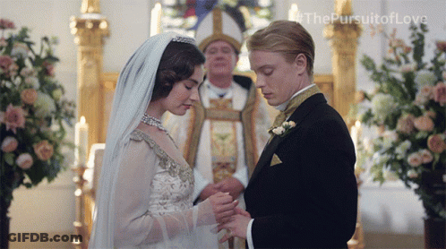 Man Putting Ring On Woman's Finger The Pursuit Of Love GIF