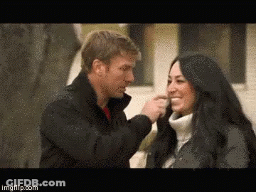 Man Putting Something On Woman's Nose GIF