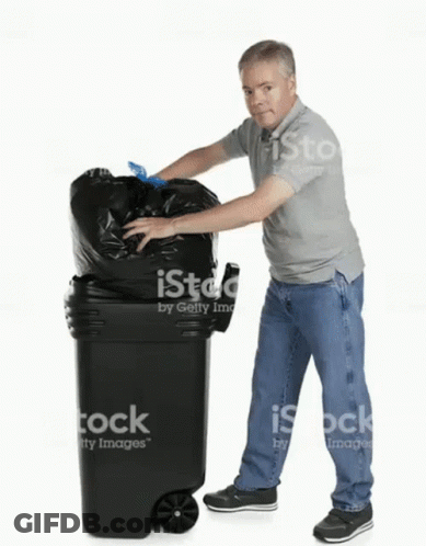 Man Putting Trash Bag Into Garbage Can GIF