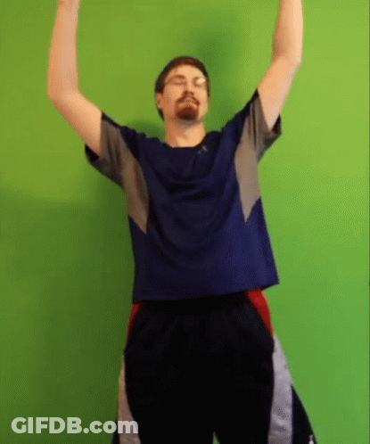 Man Raising Arms Blue Shirt Black Shorts GIF