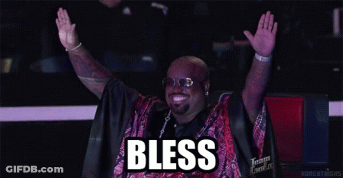 Man Raising Arms Wearing Bless Shirt GIF