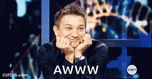 Man Reacting To TV With Awww GIF