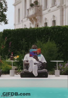 Man Reading Book By Pool Feet In Water GIF