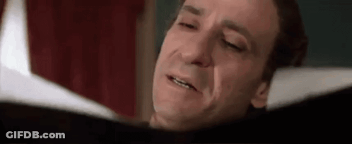 Man Reading Book Eyes Closed Crying GIF