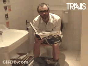 Man Reading Book On Toilet Travis GIF