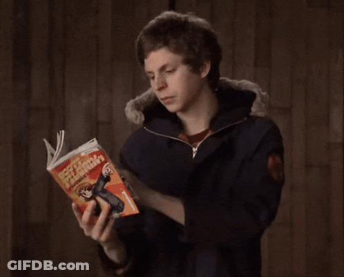 Man Reading Book With Woman Cover GIF