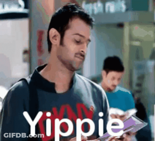 Man Reading Book With Yippie Shirt GIF