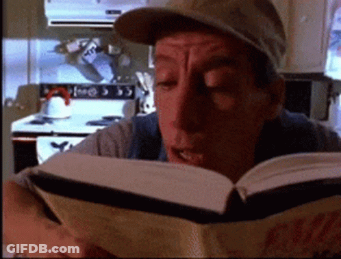 Man Reading Coca-Cola Book GIF