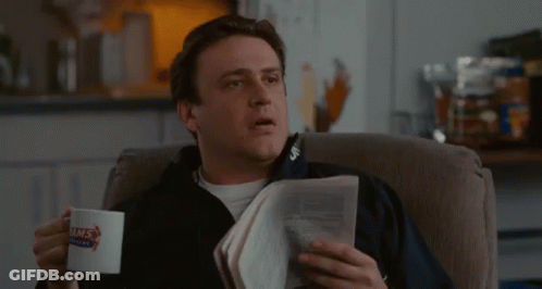 Man Reading Newspaper Holding Coffee GIF