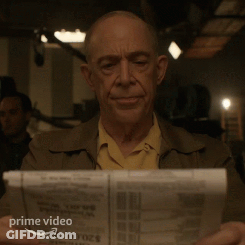 Man Reading Newspaper With Prime Video Logo GIF