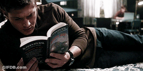 Man Reading Supernatural Book In Bed GIF