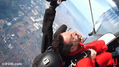 Man Red Jacket Flying With N On Helmet GIF