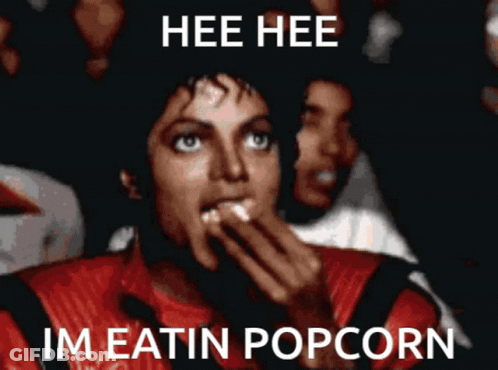 Man Red Jacket Hee Hee Im Eatin Popcorn GIF