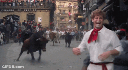 Man Red Scarf Running Past Espanol De Credito GIF