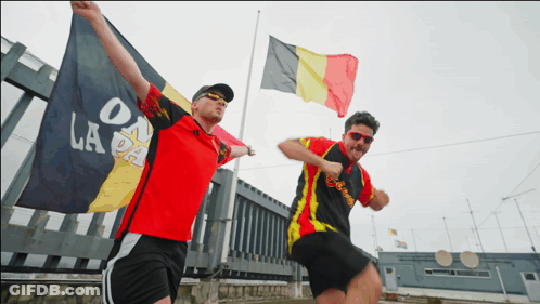 Man Red Shirt Holding Flag On La Pa GIF