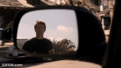 Man Reflected In Rear View Mirror GIF