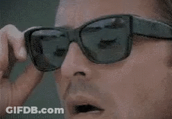 Man Removing Sunglasses And Looking GIF