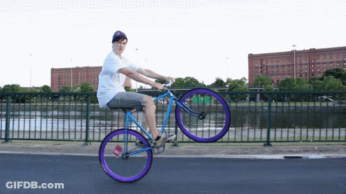 Man Riding Bicycle With Purple Wheel GIF