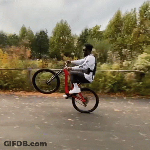Man Riding Bicycle With Supreme On Back GIF