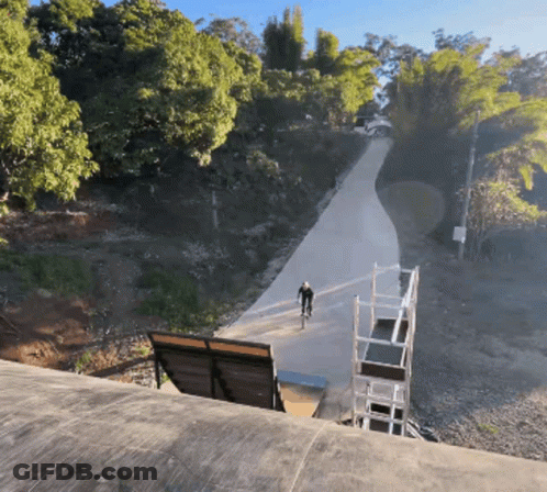 Man Riding Bike Down Hill GIF