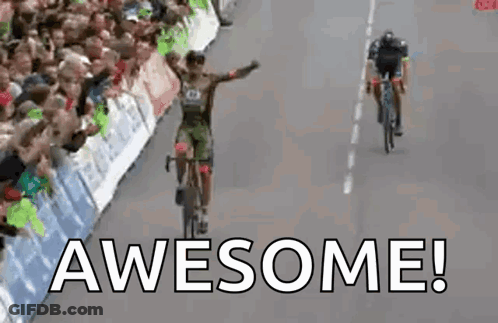 Man Riding Bike Down Road Saying Awesome GIF