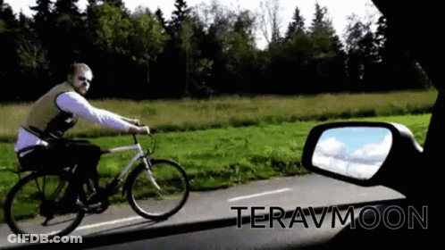 Man Riding Bike Down Road Teravmoon GIF