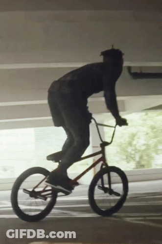 Man Riding Bike In Parking Garage GIF
