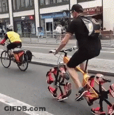 Man Riding Bike With Backpack GIF