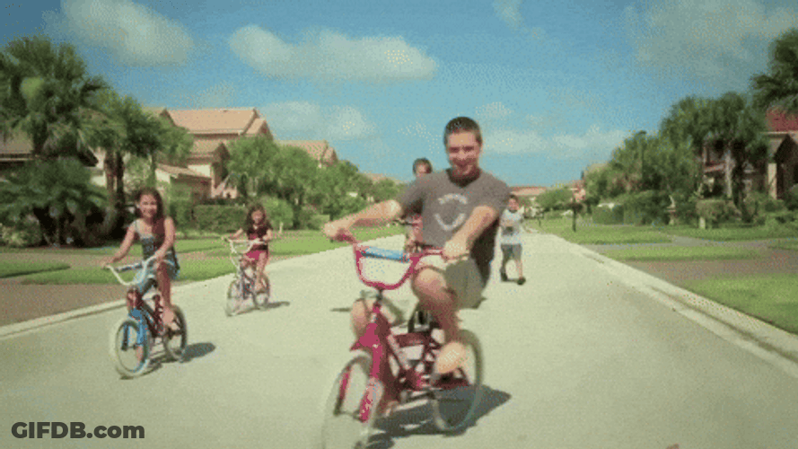 Man Riding Bike With Kids GIF
