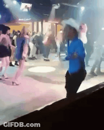 Man Riding Bull In Rodeo Arena GIF