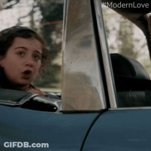 Man Riding Car With Ear Plugs On GIF