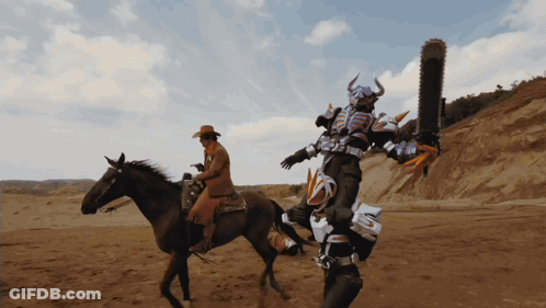 Man Riding Horse Beside Robot Costume GIF