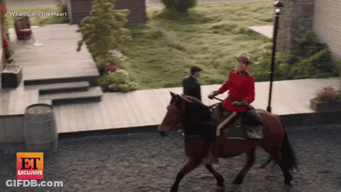 Man Riding Horse In Front Of When Calls The Heart Sign GIF