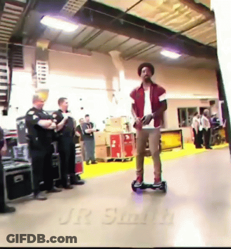 Man Riding Hoverboard With Jr Smith On Floor GIF