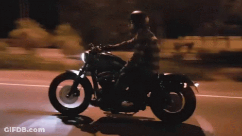 Man Riding Motorcycle At Night GIF
