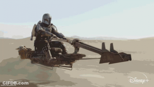 Man Riding Motorcycle In Desert With Disney+ Logo GIF