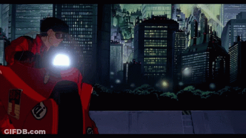 Man Riding Motorcycle In Futuristic City GIF