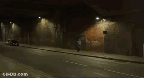 Man Riding Motorcycle In Tunnel At Night GIF