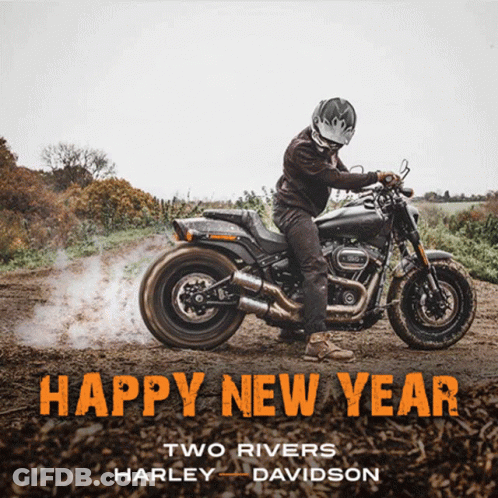 Man Riding Motorcycle On Dirt Road Saying Happy New Year GIF